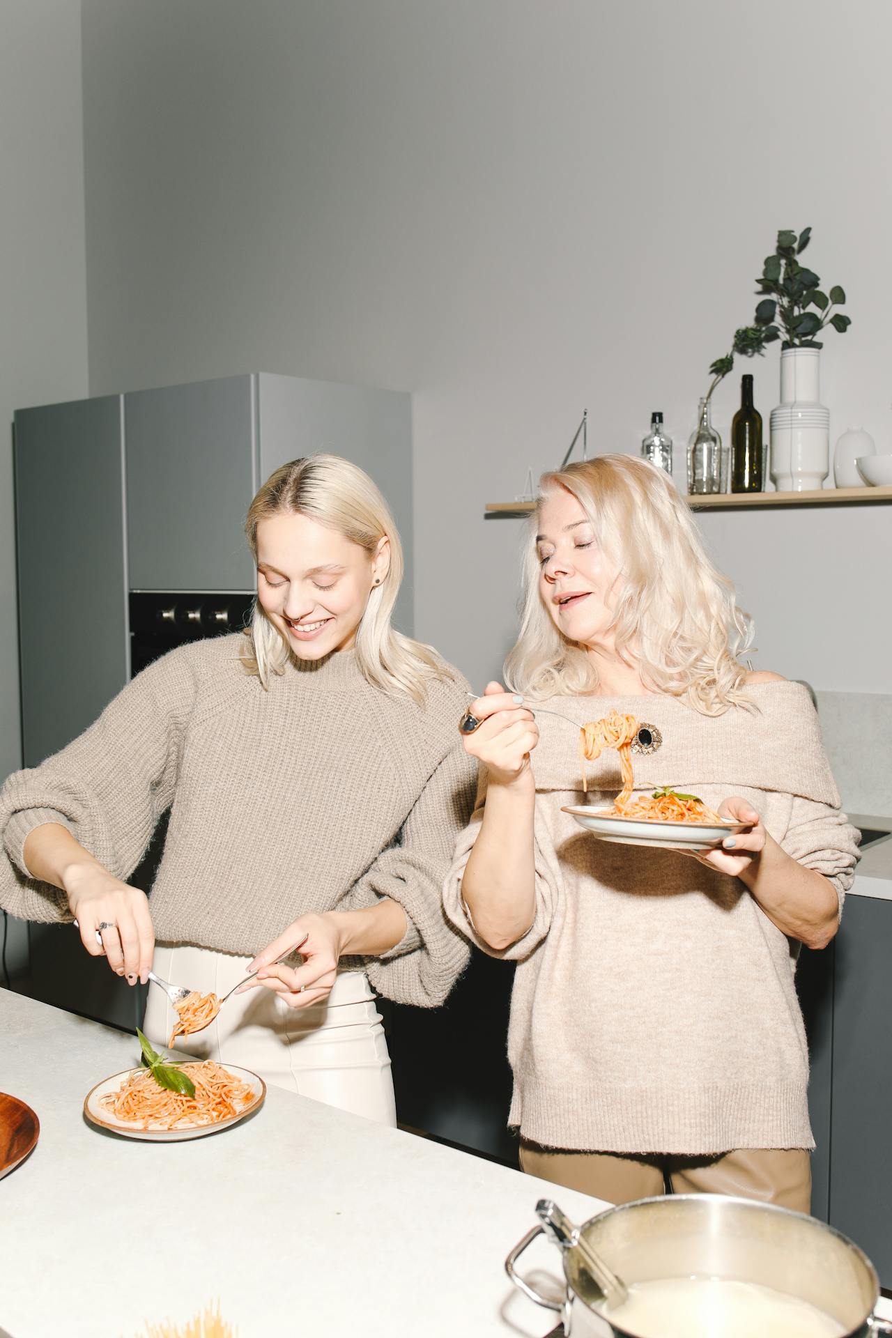two women eating pastajpg